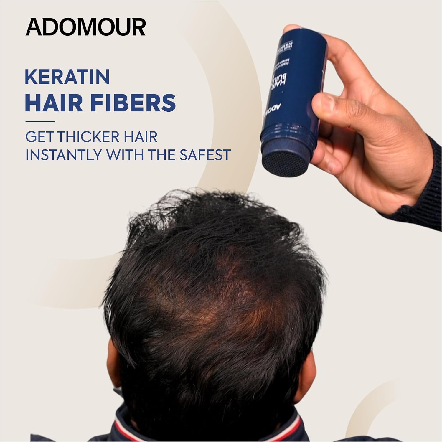 Person applying Adomour keratin hair fibers to thin hair, with product packaging visible.
